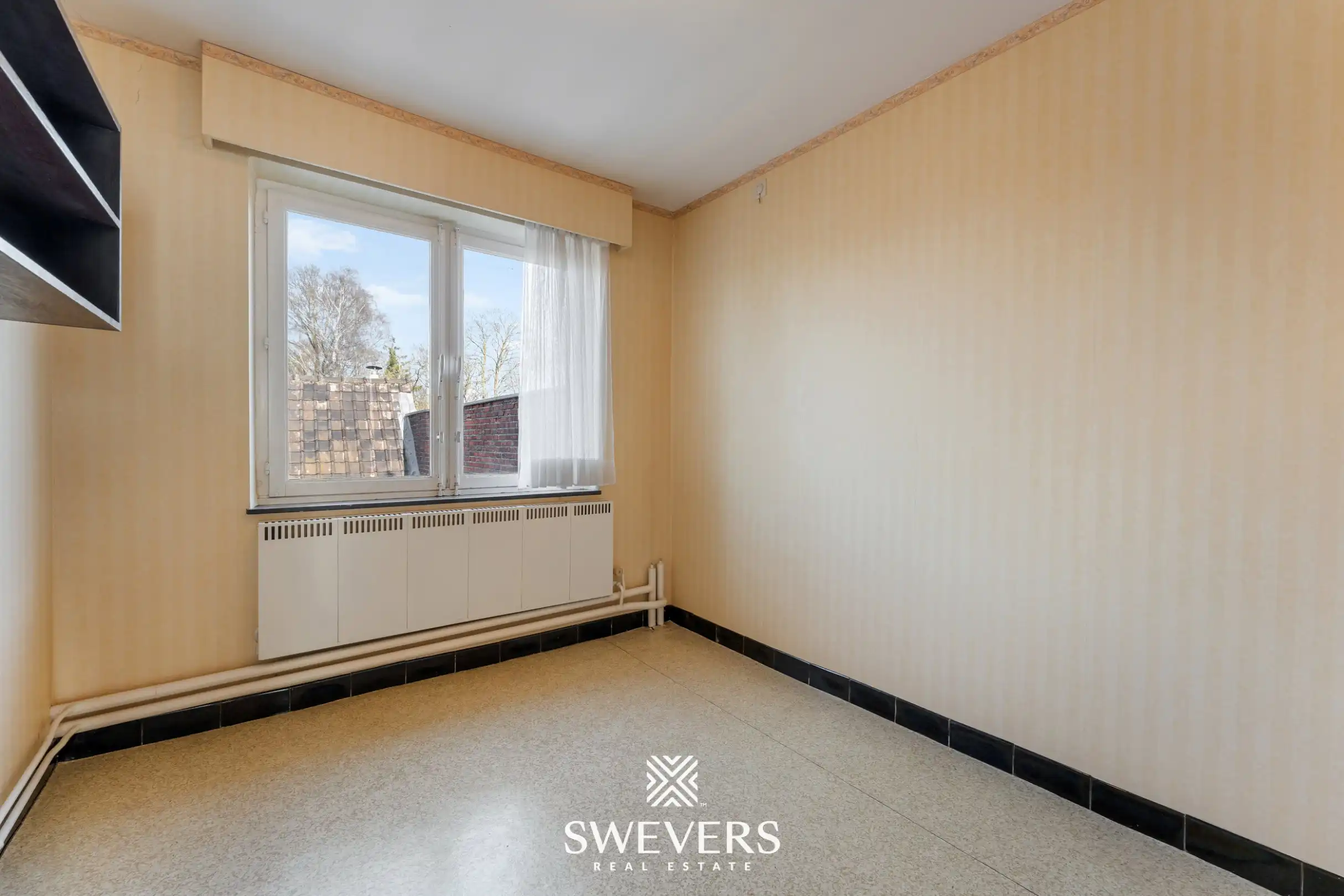 Te renoveren woning met 4 slaapkamers, grote tuin en omliggende velden op rustige ligging nabij centrum Diepenbeek foto 21