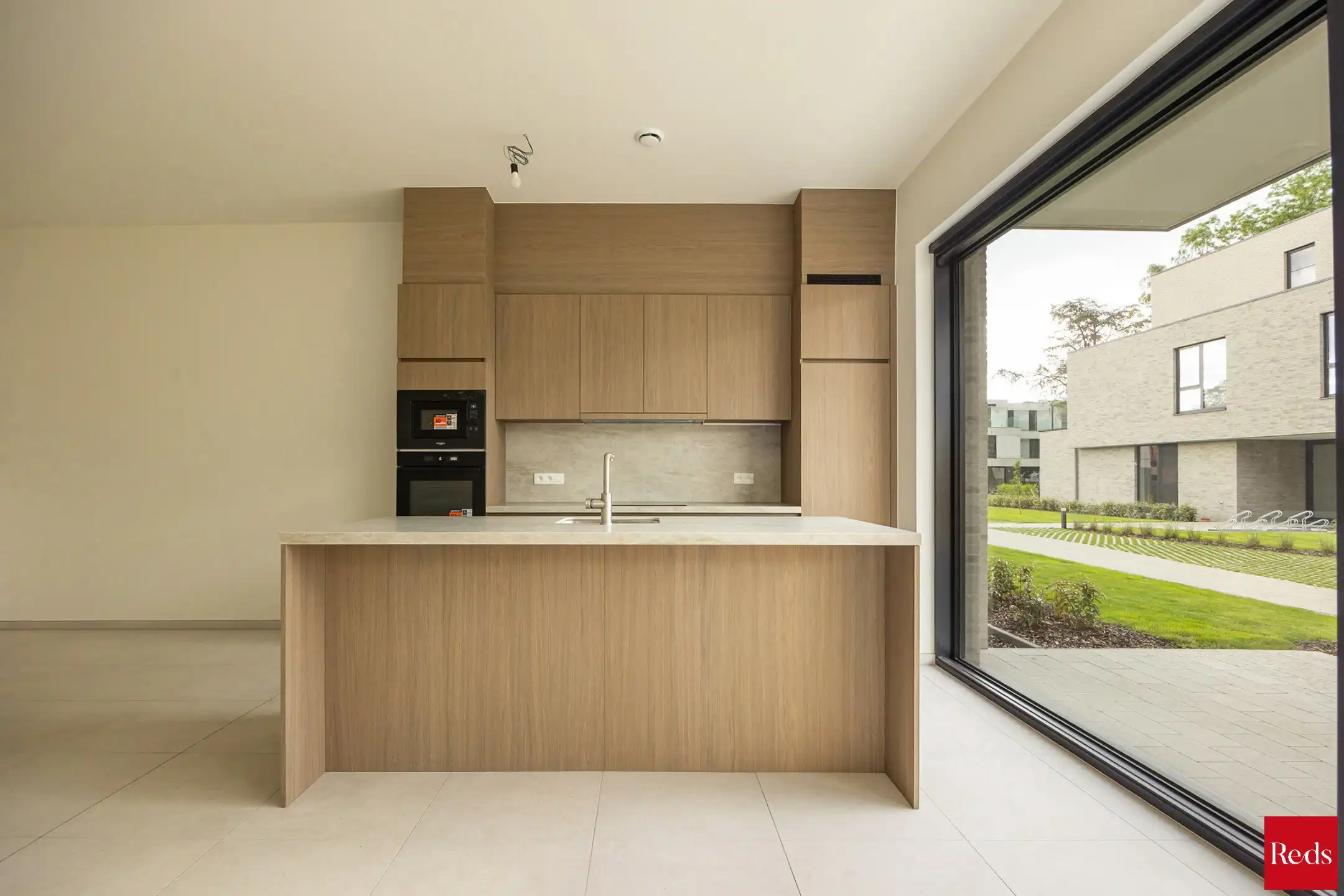 Ruim gelijkvloers nieuwbouwappartement met 3 slaapkamers foto 4
