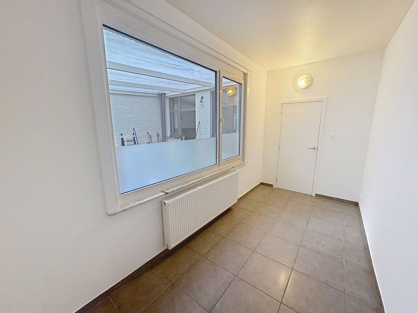 Gelijkvloers appartement met stadstuin foto 13