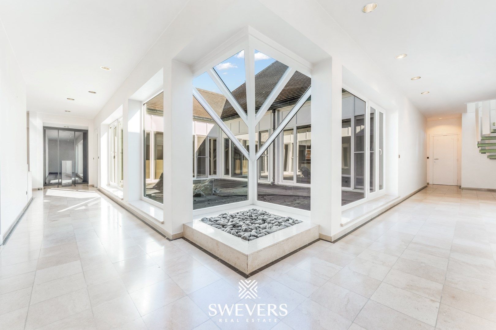 Handelspand met ruime woning in hartje Lummen – een unieke opportuniteit foto 12