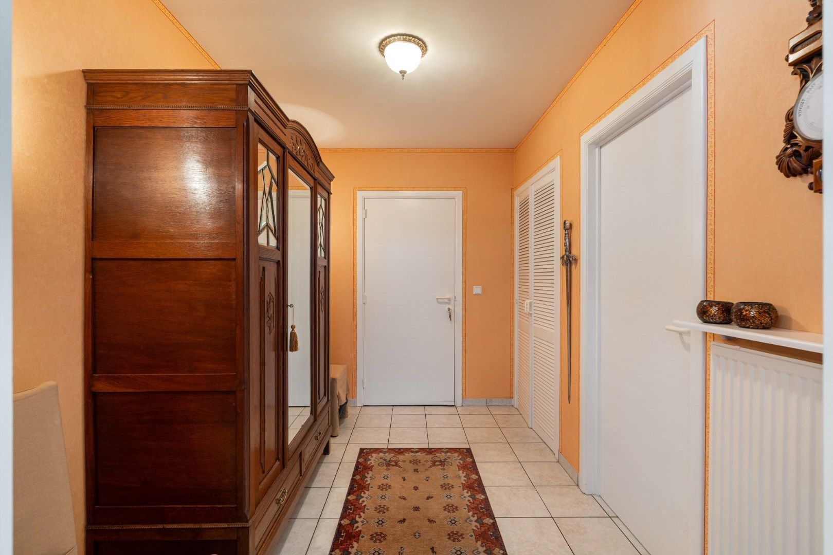 Verzorgd gelijkvloers appartement met 2 slaapkamers, ruim terras, garage en berging foto 5