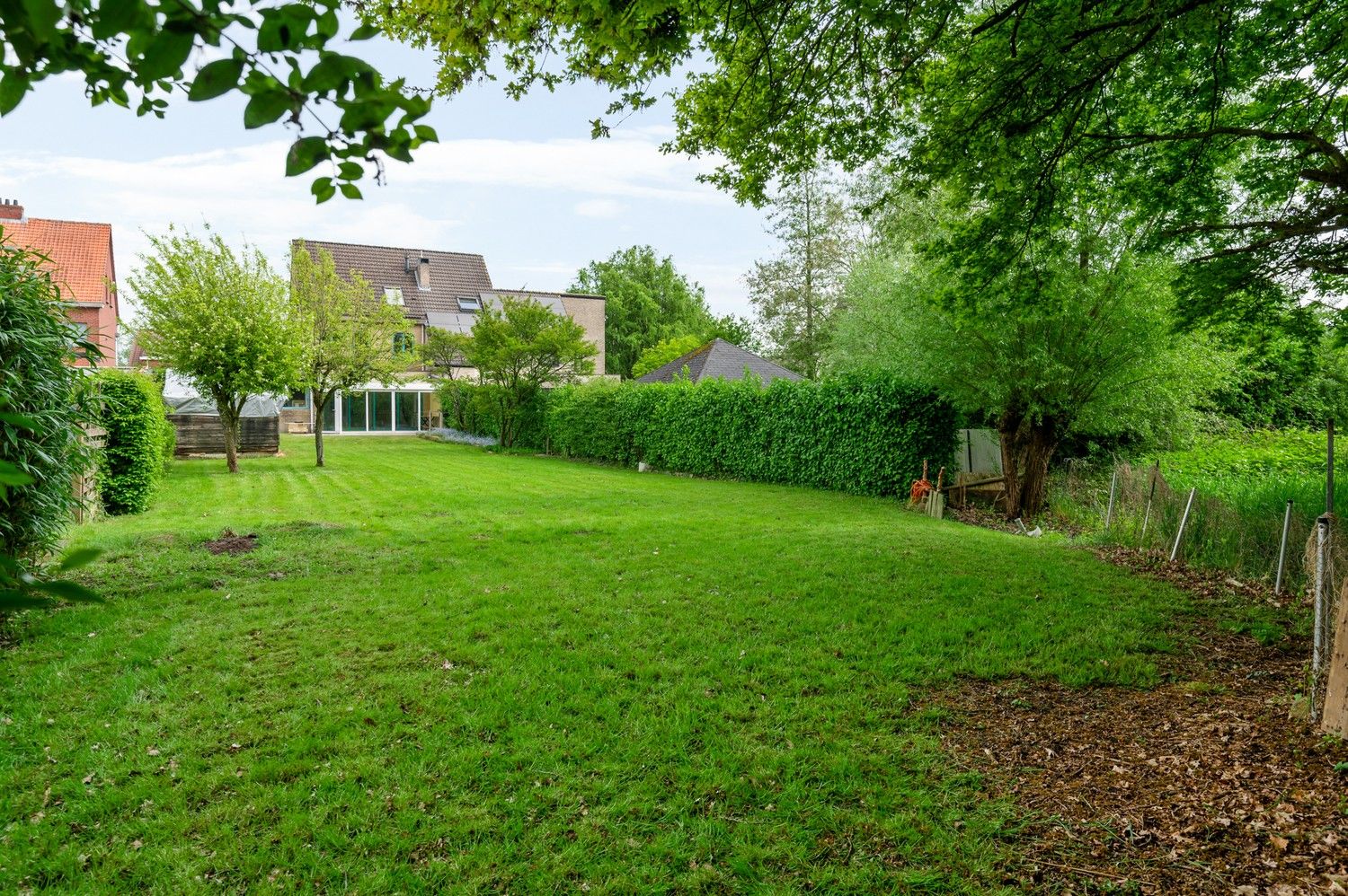 Ruime halfopen bebouwing met zuidwest georiënteerde tuin te Lint foto 3