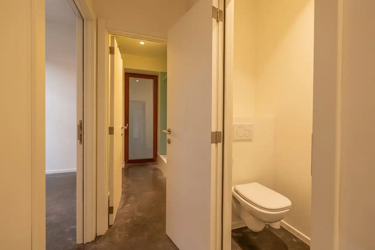 Ruim gelijkvloers appartement met zonnige tuin op toplocatie foto 19