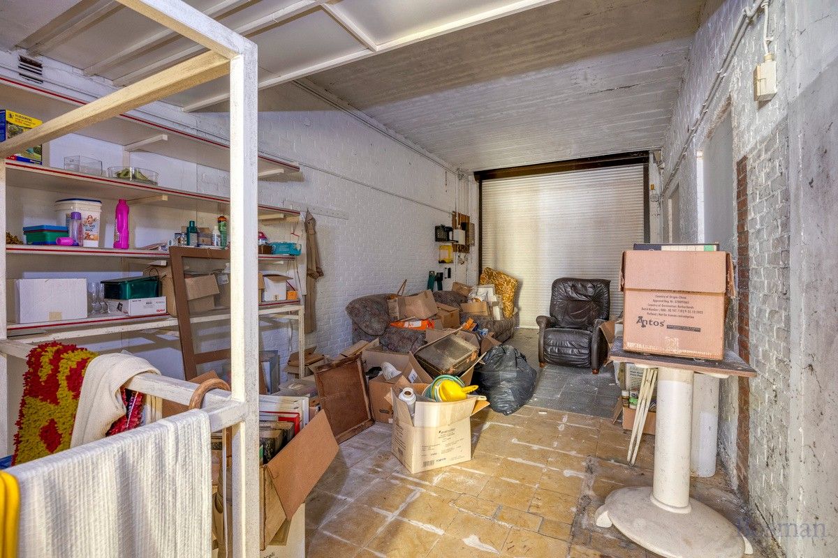 Te renoveren woning met 5 garageboxen te koop in Ham foto 28