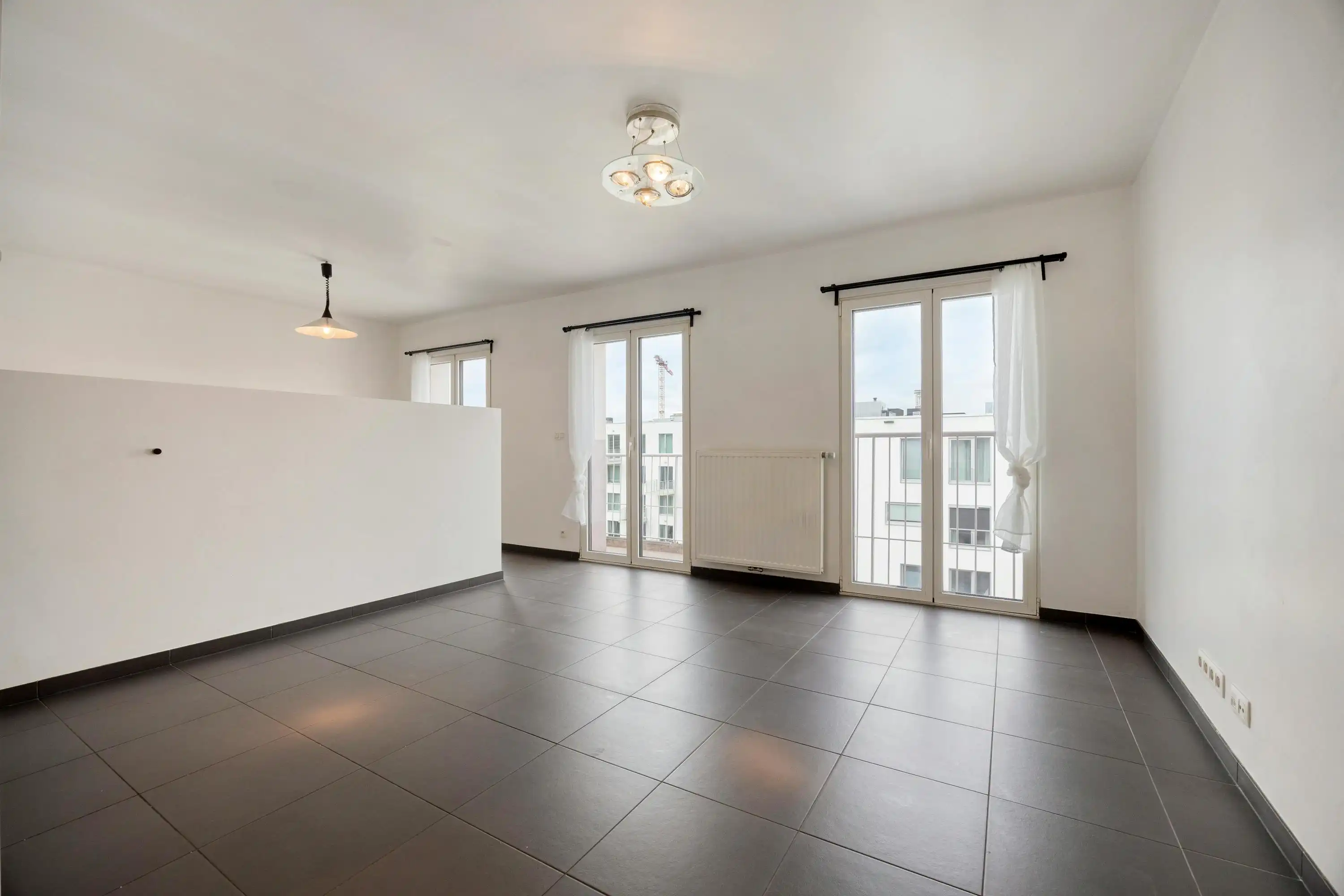 Penthouse Studio met zicht op Tour & Taxis Te koop  foto 2