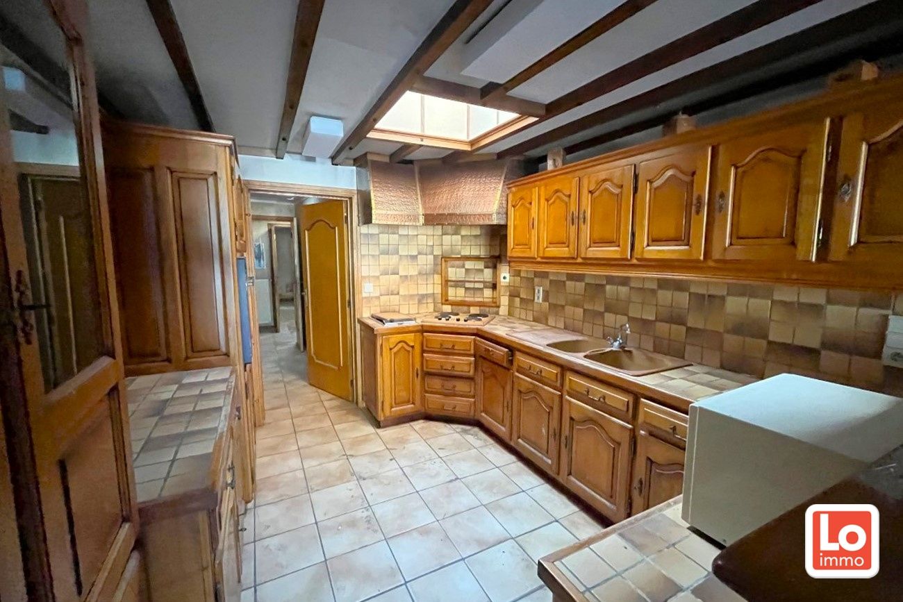 Te renoveren woning met 3 slaapkamers en tuin op een topligging in Centrum Lochristi foto 7