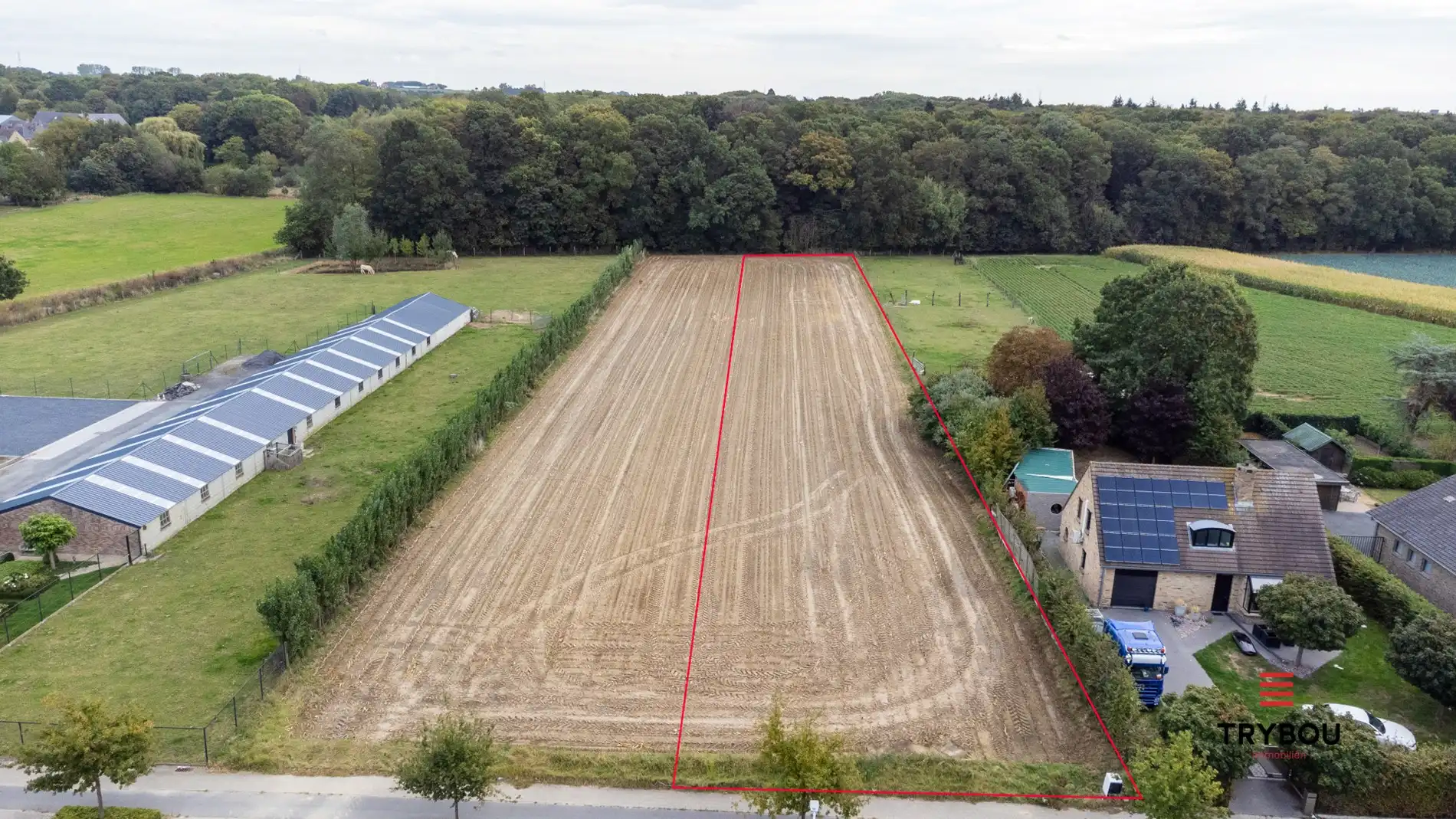 Bouwgrond met natuurstrook te koop in Houthulst – 3518 m²  foto {{pictureIndex}}