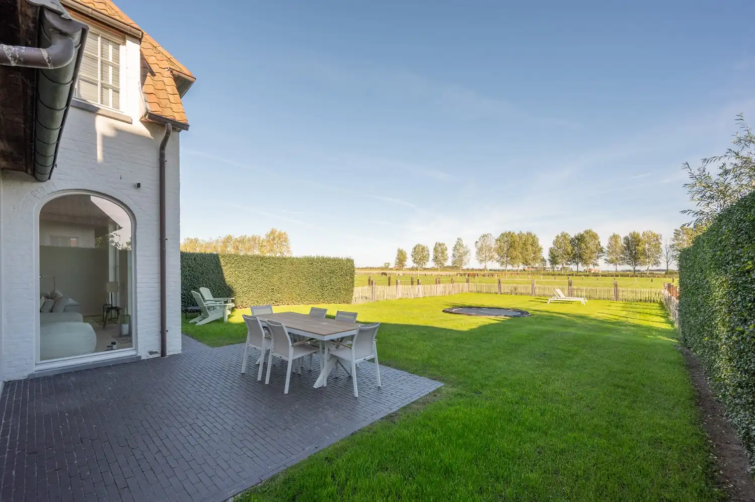 Rustig gelegen koppelvilla met prachtige tuin en open zicht over de weilanden foto 6