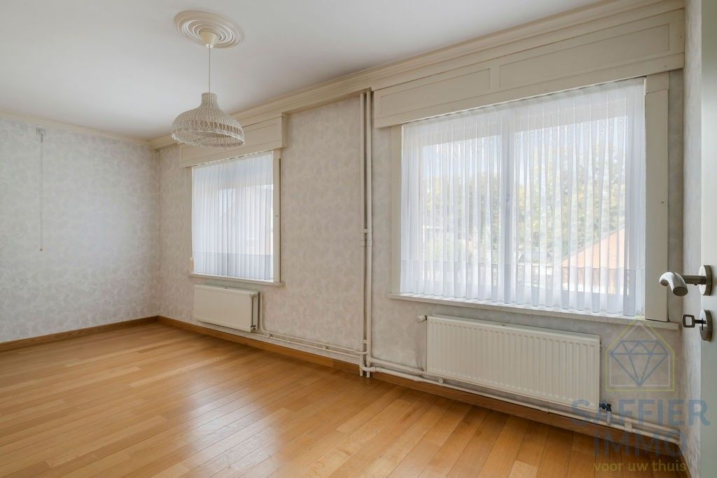 Ruime woning zonder renovatieplicht in de Seizoenswijk te Kuurne foto 23