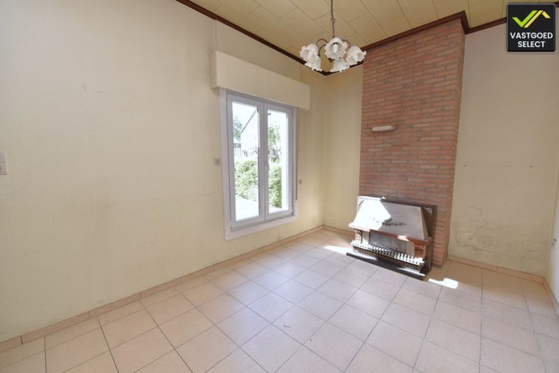 Vastgoed Select: Halfopen bebouwing met zonnige tuin, garage en renovatiepotentieel in Eeklo foto 5
