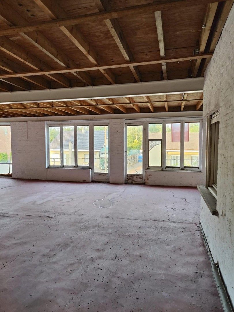 Woning met loods en voormalige showroom foto 4