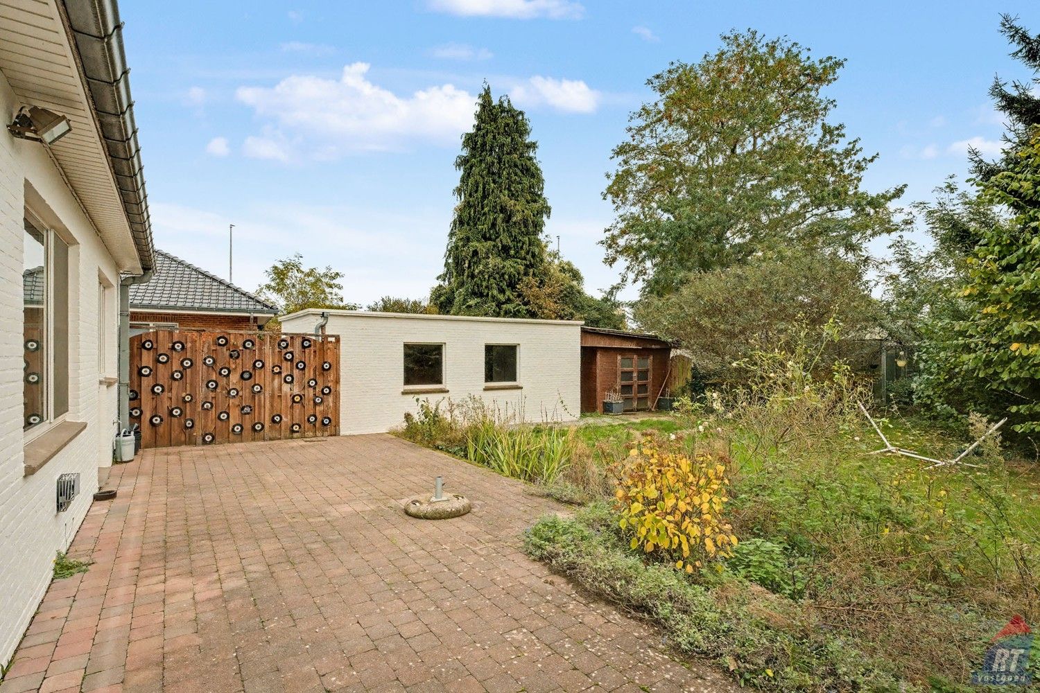 Gelijkvloerse halfopen woning met tuin en renovatiepotentieel in het hart van Sint-Truiden foto 19