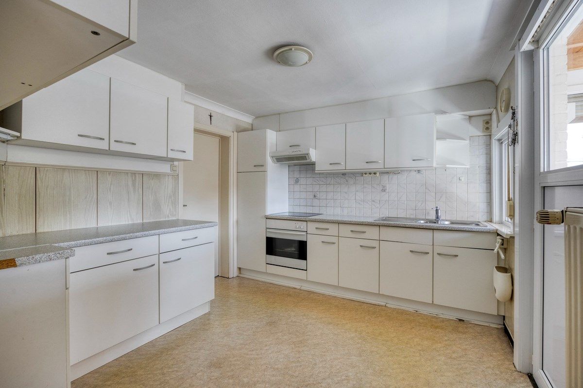 Ruim ingedeelde woning met 3slpks op een gunstige ligging. foto 7