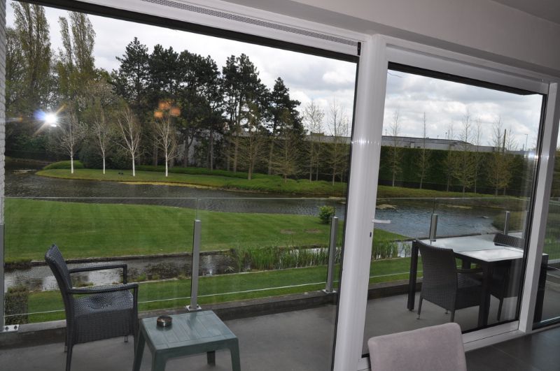 Stijlvol afgewerkt appartement met garage in privé domein De Steelander met natuurvijver en parktuin. foto 11