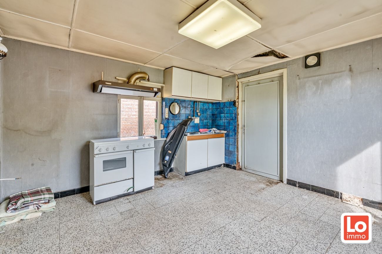 Landelijk gelegen halfopen afbraakwoning op groot perceel grond met open zicht in Zeveneken! foto 13