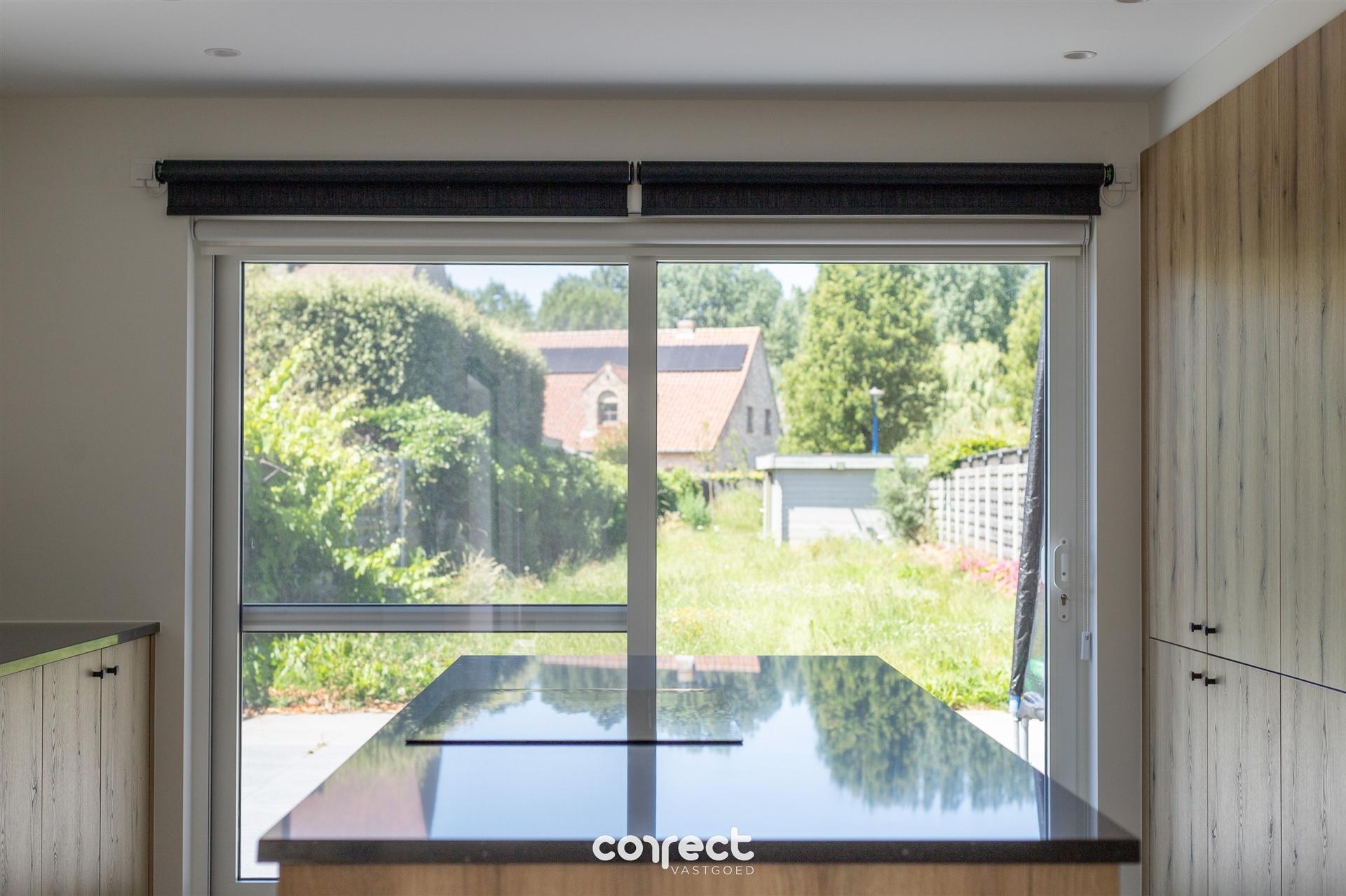 Modern halfopen woning te koop in hartje Oostduinkerke met 3 slaapkamers en diepe tuin foto 16
