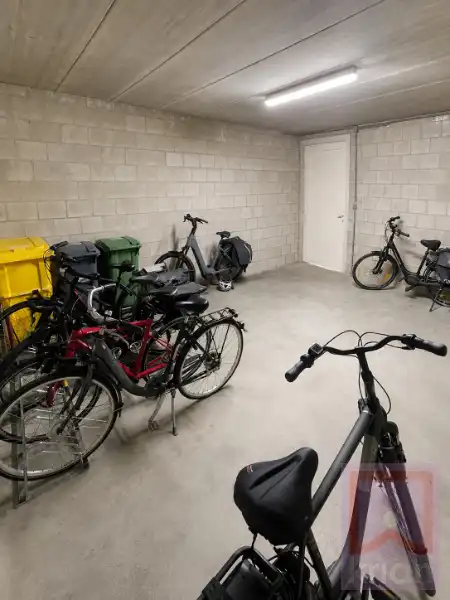 Volledig instapklaar gelijkvloers appartement met 2 slaapkamers, ruime tuin én garagebox foto 21