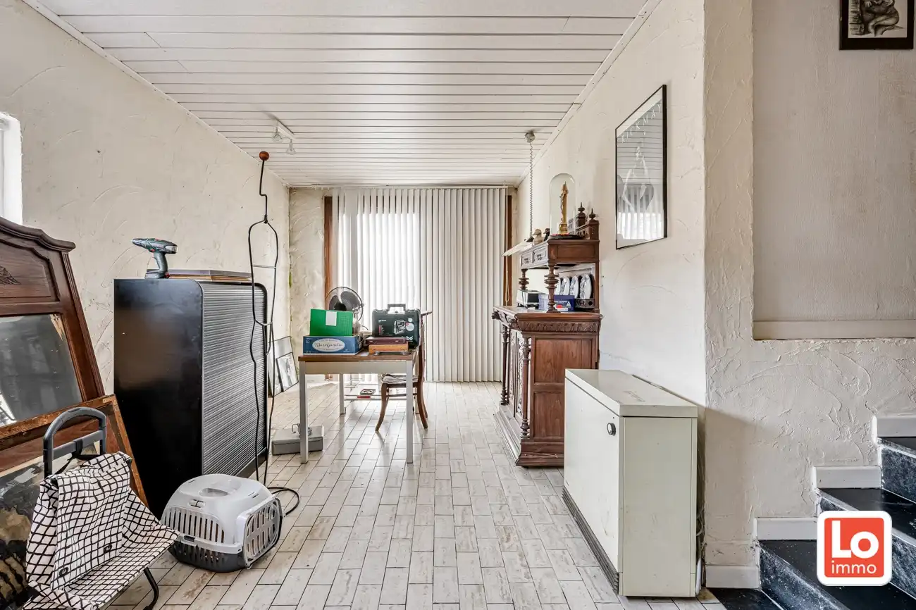 Ruime volledig te renoveren open gelijkvloerse prefab woning met inpandige garage en tuin met open zicht of perceel bouwgrond met afbraak/heropbouw mogelijkheden aan 6% BTW op een rustige locatie nabij het centrum van Zeveneken! foto 24