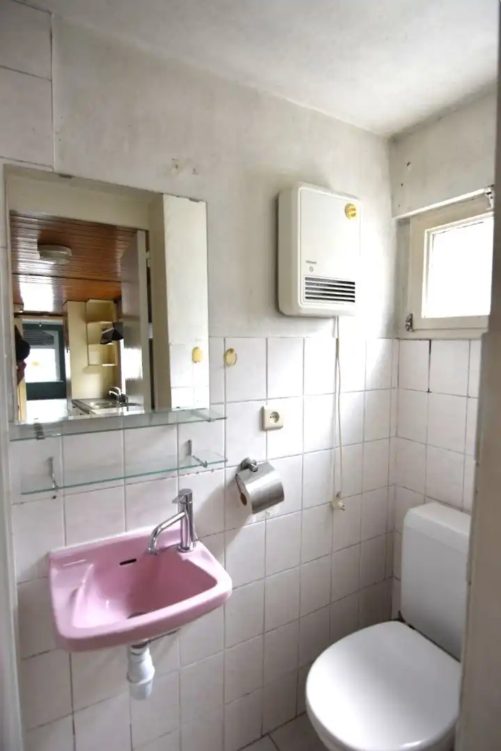 Te renoveren rijwoning met goeie ligging foto 9