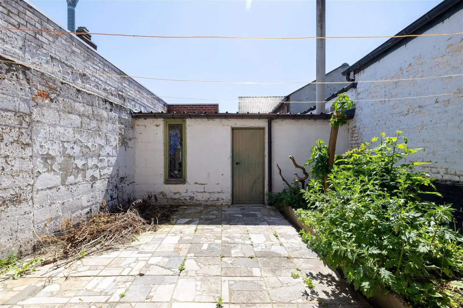 Te renoveren woning mét garage foto 6
