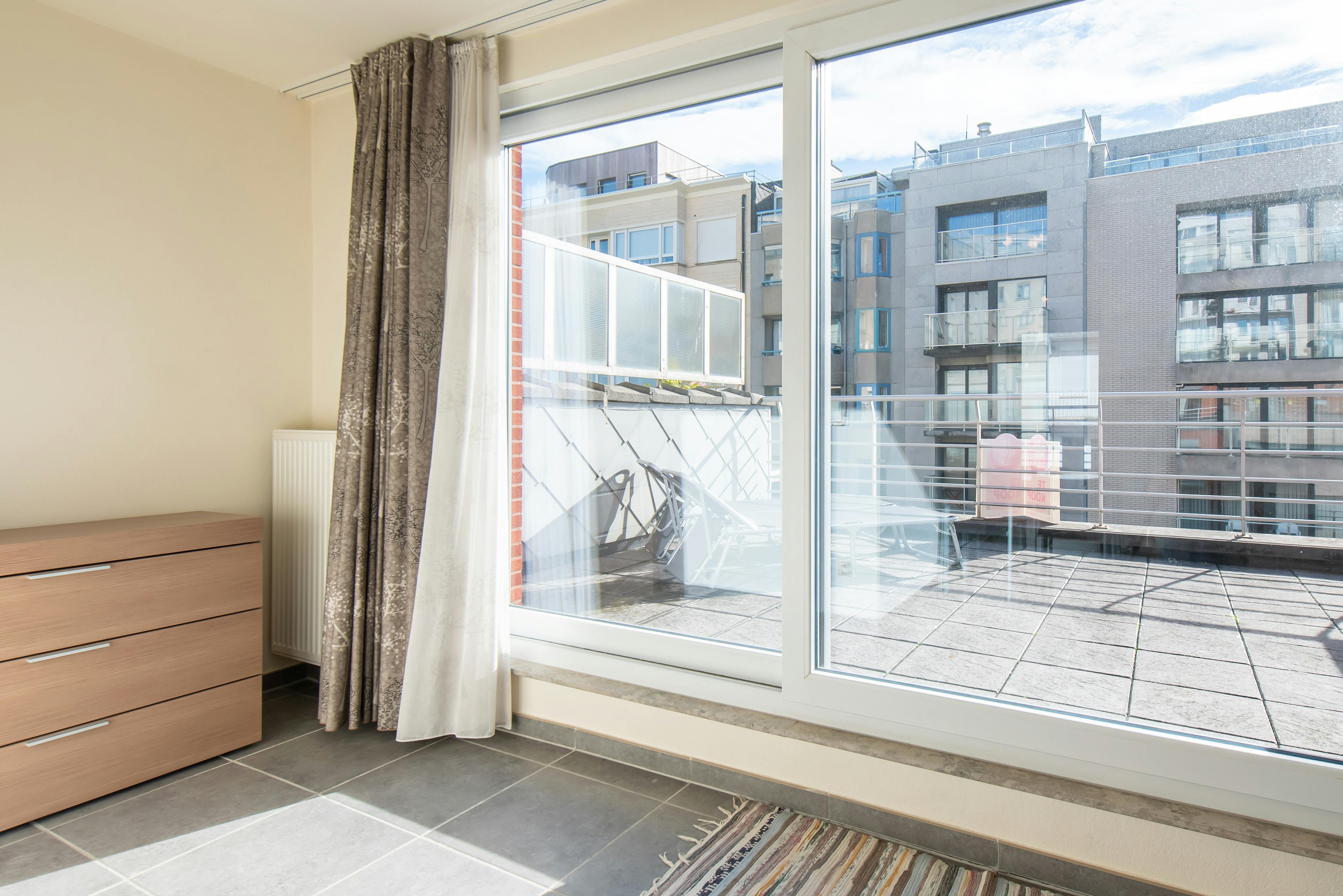 Zuidgerichte penthouse studio met ruime terrassen op topligging! foto 11