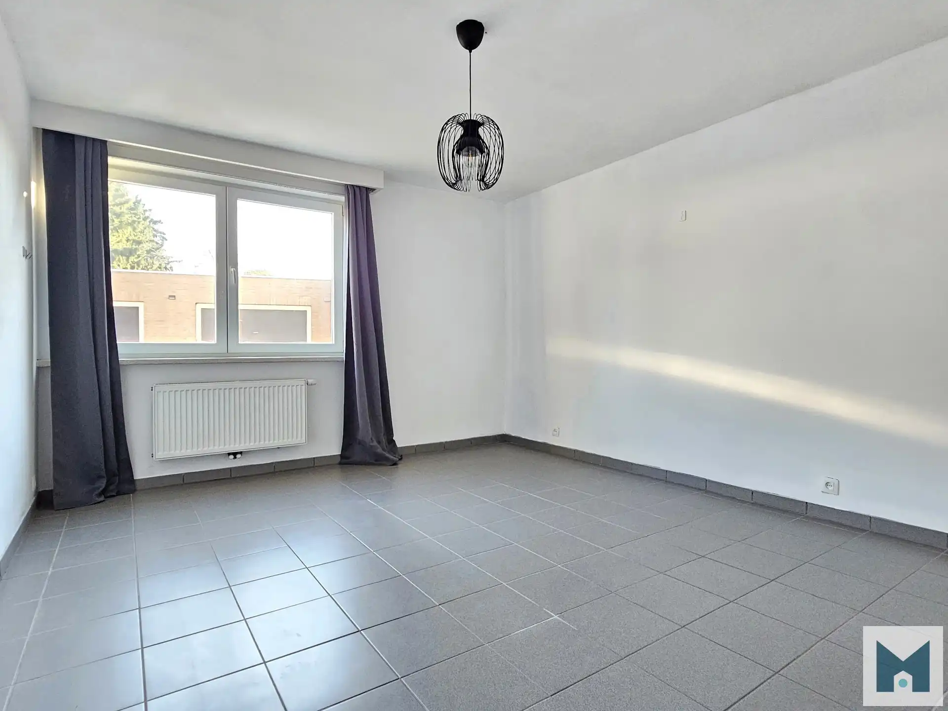 Ruim gerenoveerd app. met 3 slpks, een garage en gem. tuin! foto 8