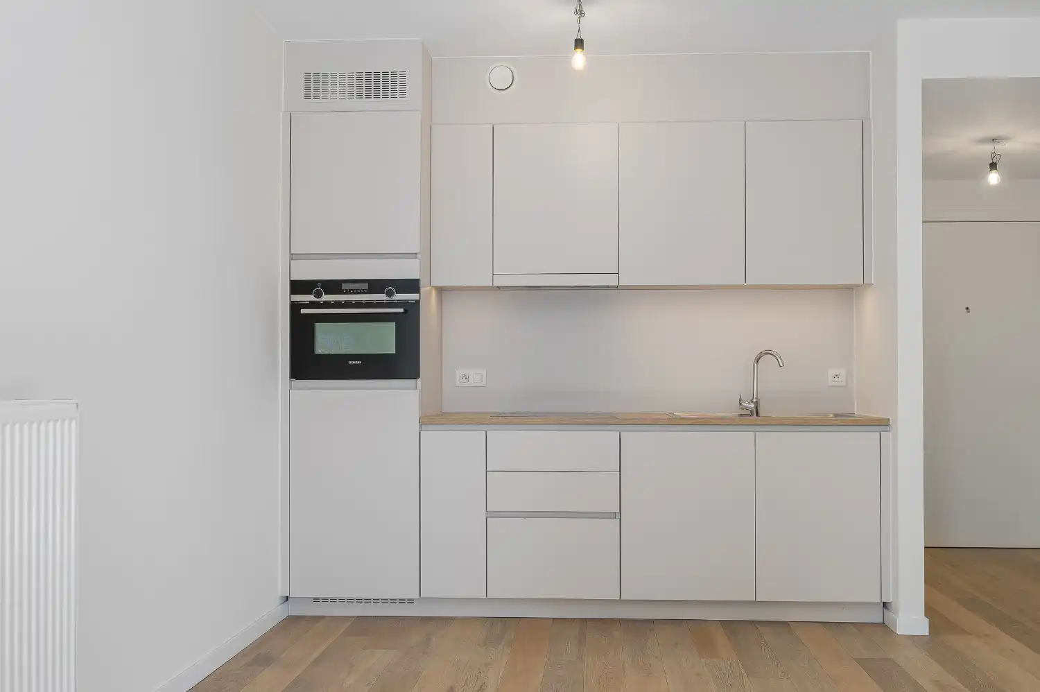 Assistentie-appartement met zijdelings zeezicht op steenworp van de zeedijk. foto 4