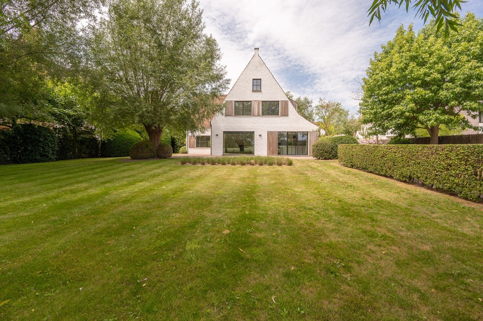 Alleenstaande villa genietend van prachtige open zichten op de polders. foto {{pictureIndex}}