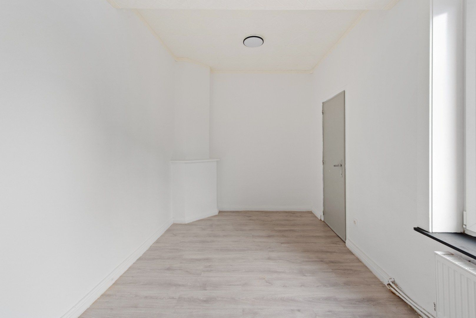 Polyvalente rijwoning met grote handelsruimte te Tienen foto 13