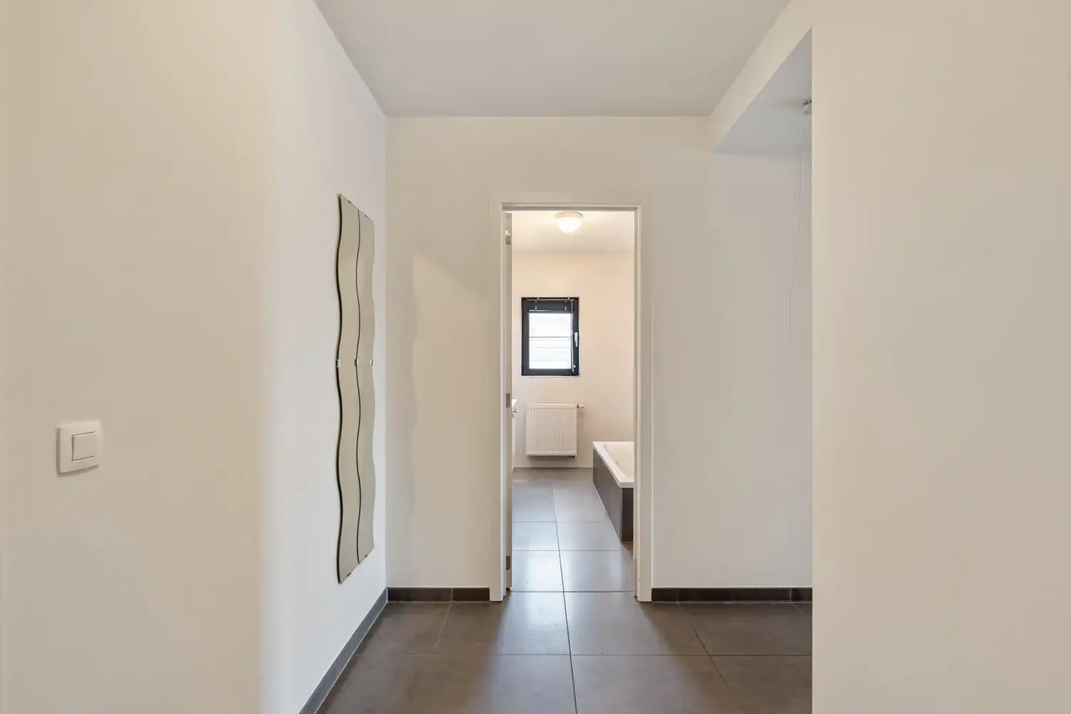 Modern en energiezuinig(A-label) dakappartement met 2 slaapkamers, 2 badkamers, een groot terras en een autostaanplaats nabij het UZ Gasthuisberg te Leuven! foto 4