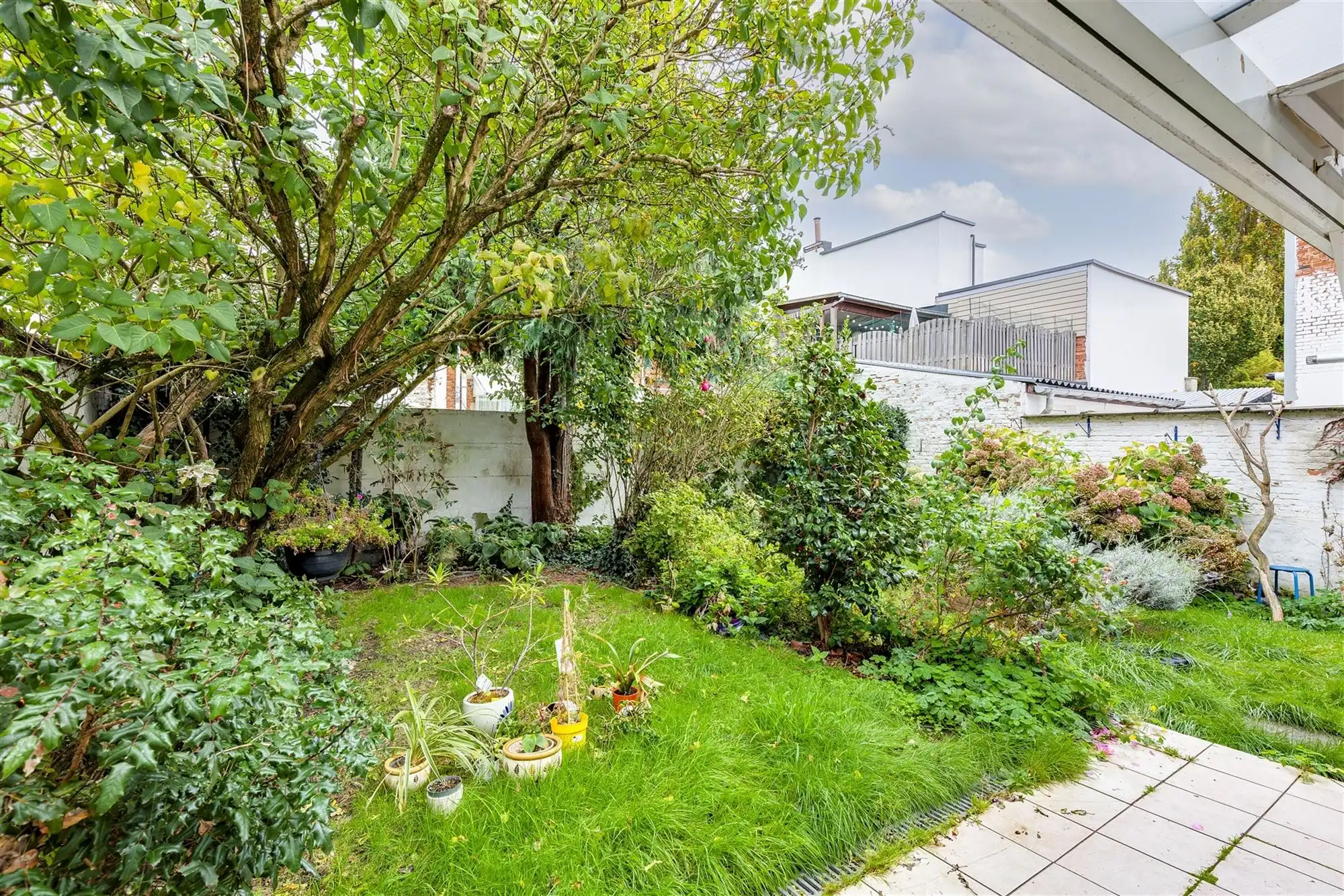 Te renoveren woning met tuin in Merksem foto 13