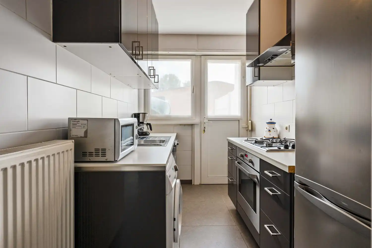 Instapklaar gelijkvloers appartement met zonnige tuin foto 7
