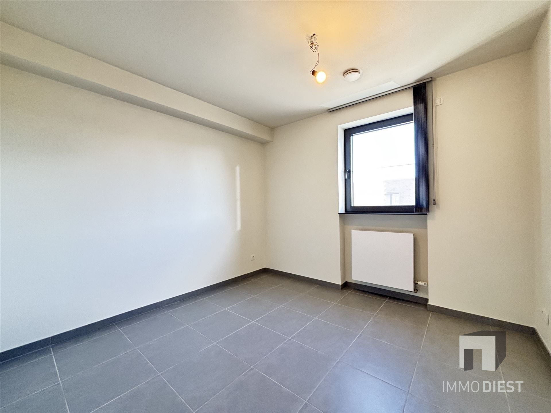 Ruim appartement op de tweede verdieping in het centrum van Tessenderlo foto 12