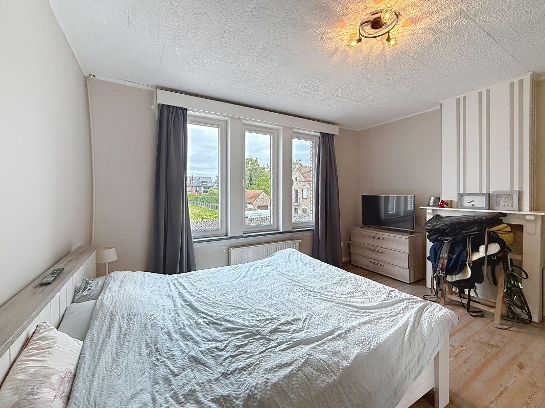 Charmante, instapklare rijwoning met uitweg achteraan. foto 12