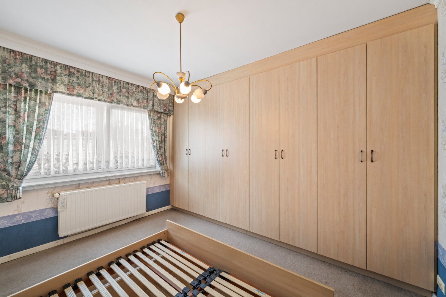Rijwoning met potentieel, zonnige tuin, garage en uitbreidingsmogelijkheden te koop in Ruddervoorde foto 12