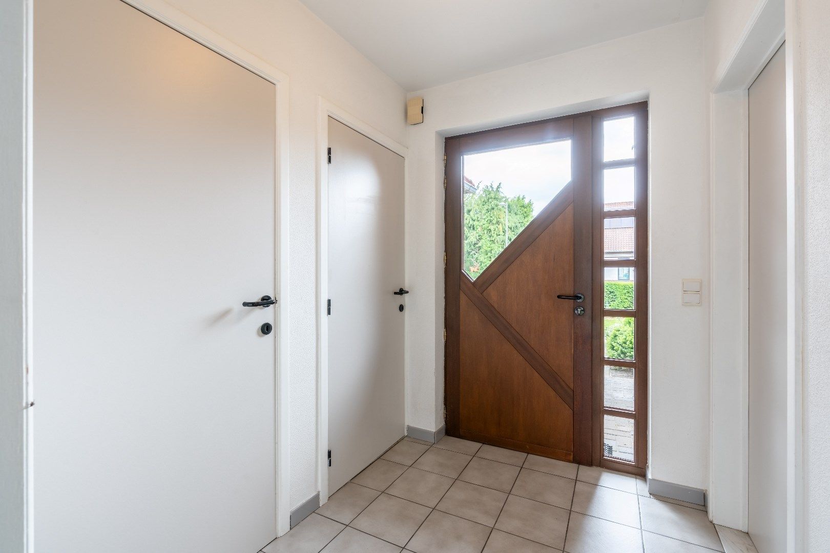 Comfortabel gebouw, onderverdeeld in een gelijkvloers appartement en een woning (210 + 210A), op een perceel van 9a60 met diverse mogelijkheden (kangoeroewoning foto 19