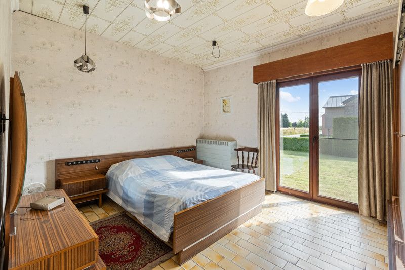 Gelijkvloerse woning met grote loods achteraan op 25are foto 21