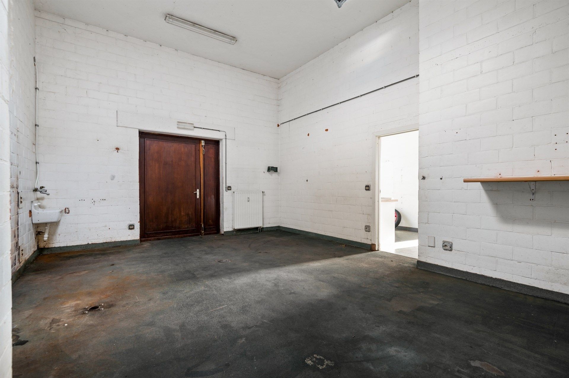 Handelspand met ruim appartement op een toplocatie in Sint-Gillis-Waas foto 8