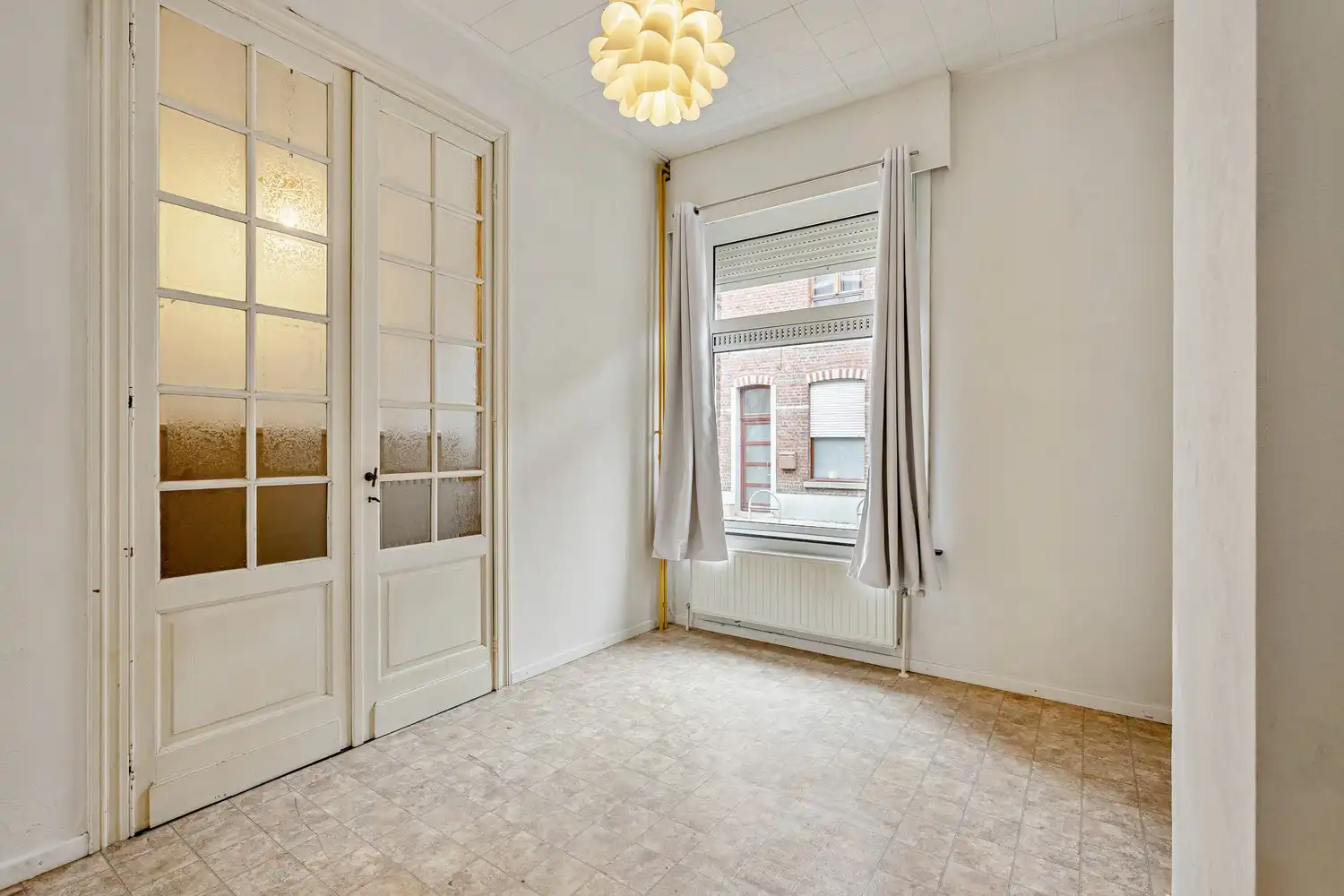 Goed gelegen rijwoning met 2 slaapkamers en een af te werken zolderruimte te Leuven! foto 3