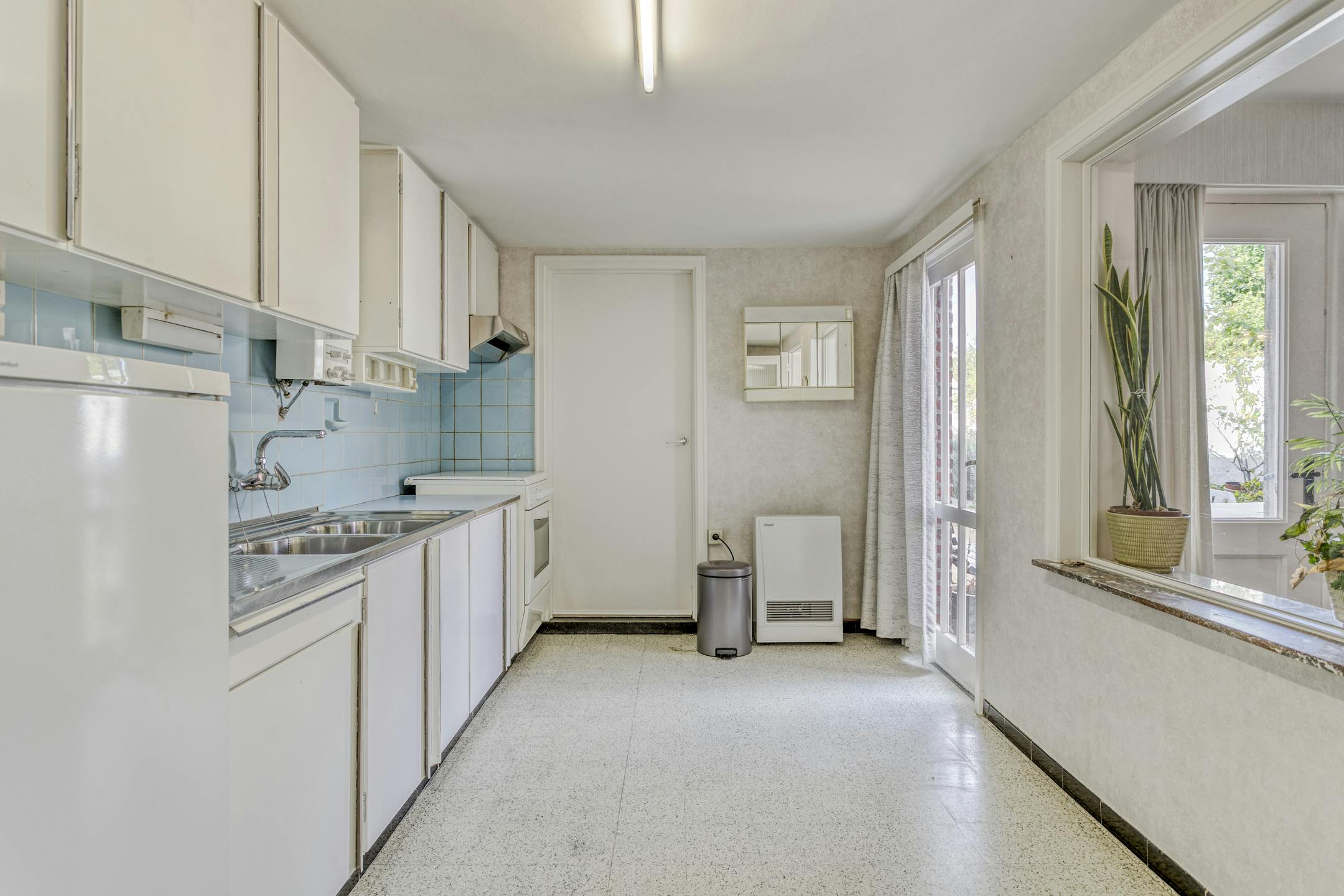Karaktervol huis met zonnige tuin, 3 slaapkamers én garage met uitweg foto 9