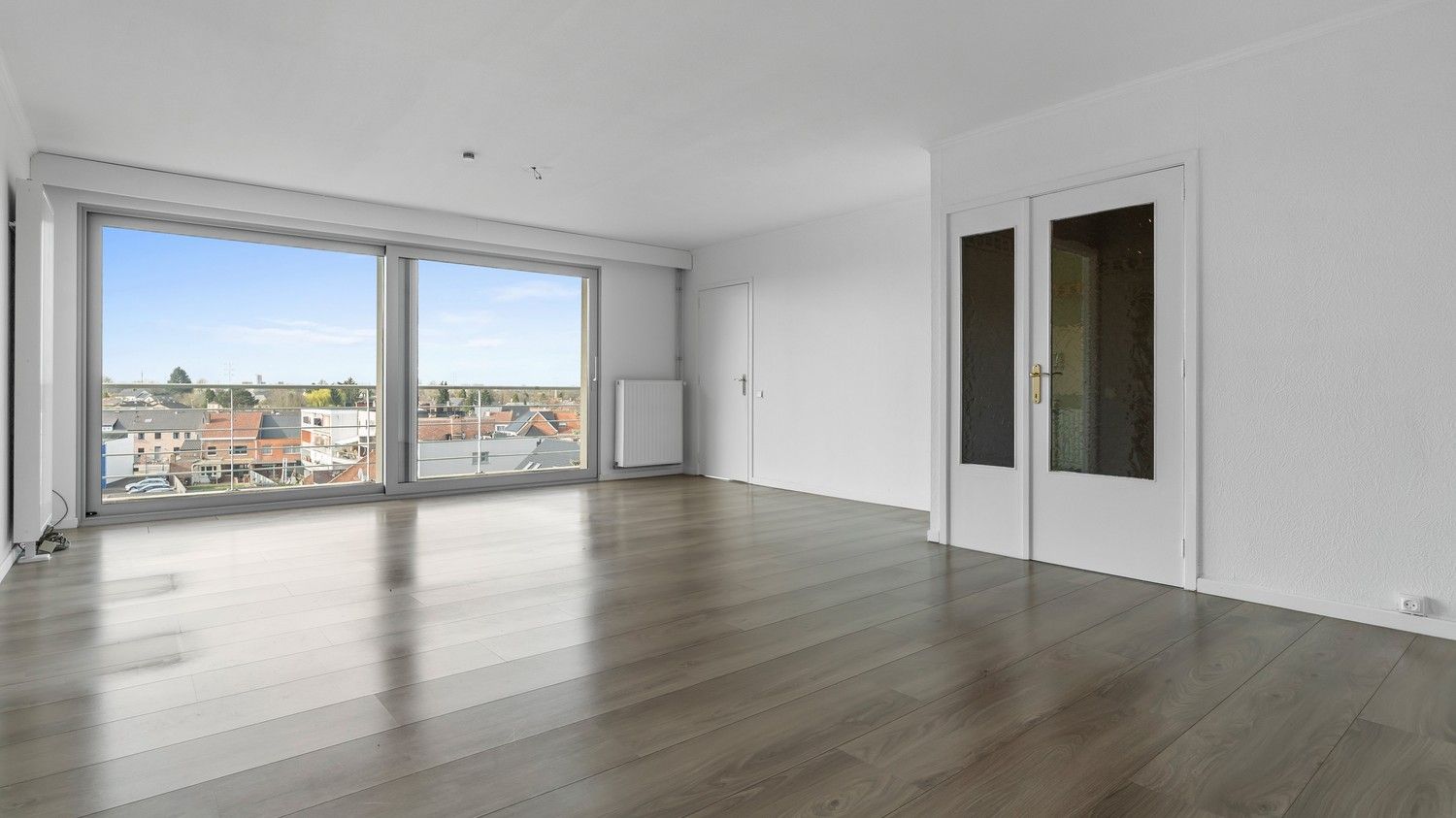 Ruim en lichtrijk appartement met 3 slaapkamers, kelder en autostaanplaats foto 4