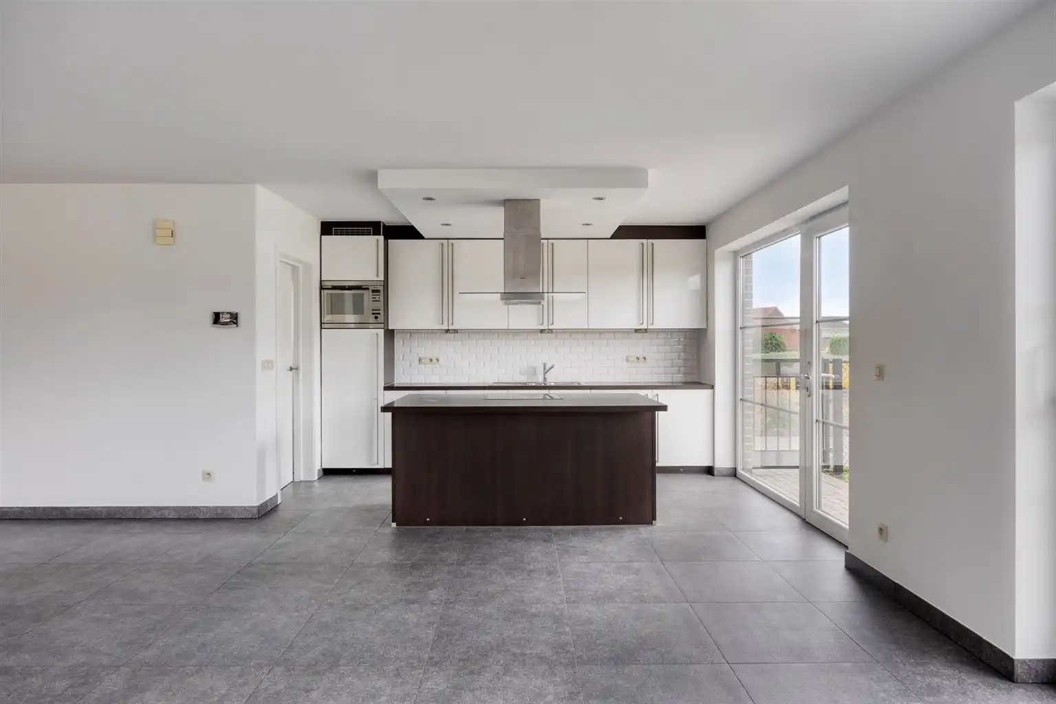 Instapklaar gelijkvloers appartement met 2 slaapkamers, ruime tuin en parkeergelegenheid op een rustige toplocatie in Opitter.  foto 5