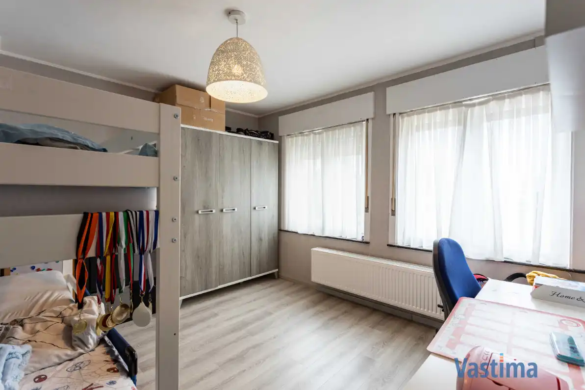 Instapklare gezinswoning met 2 staanplaatsen, zonnige tuin en parkzicht foto 17