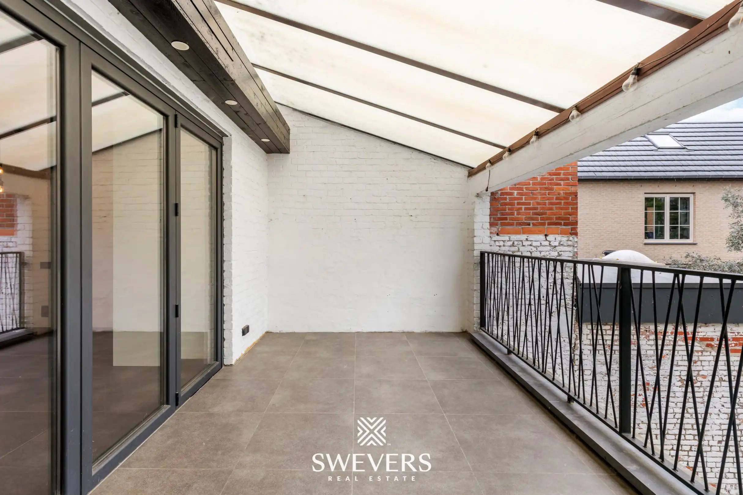 Instapklare en energiezuinige rijwoning met tuin, terras en garage in hartje Leopoldsburg foto 13