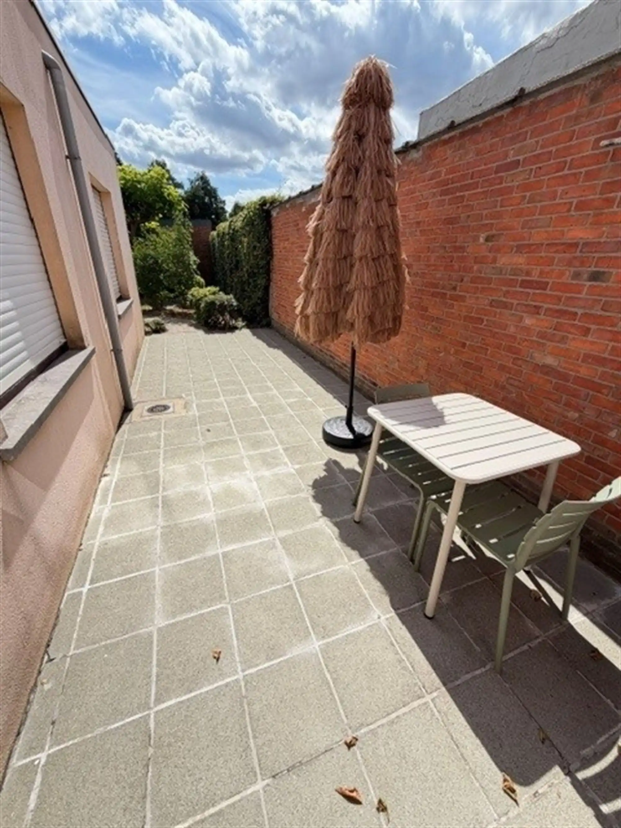 Zeer tof gelijkvloersappartement met tuin en garagebox foto 2