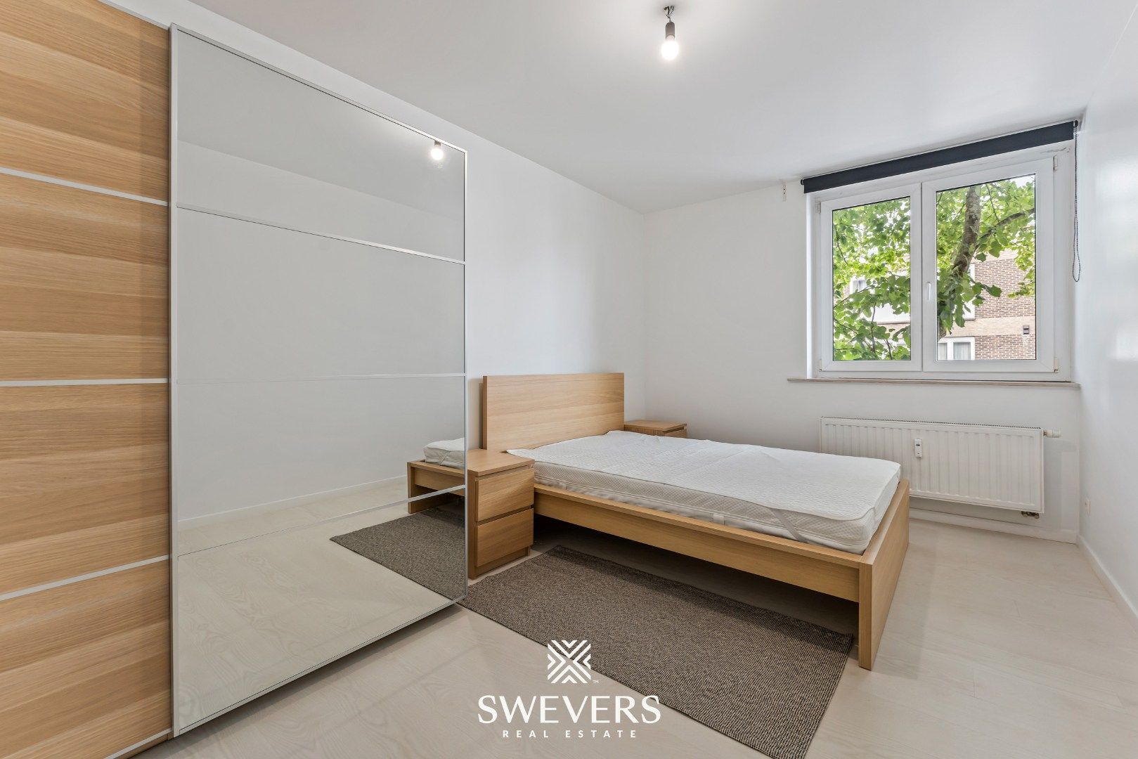 Instapklaar en energiezuinig 2-slaapkamerappartement in het centrum van Heppen foto 14