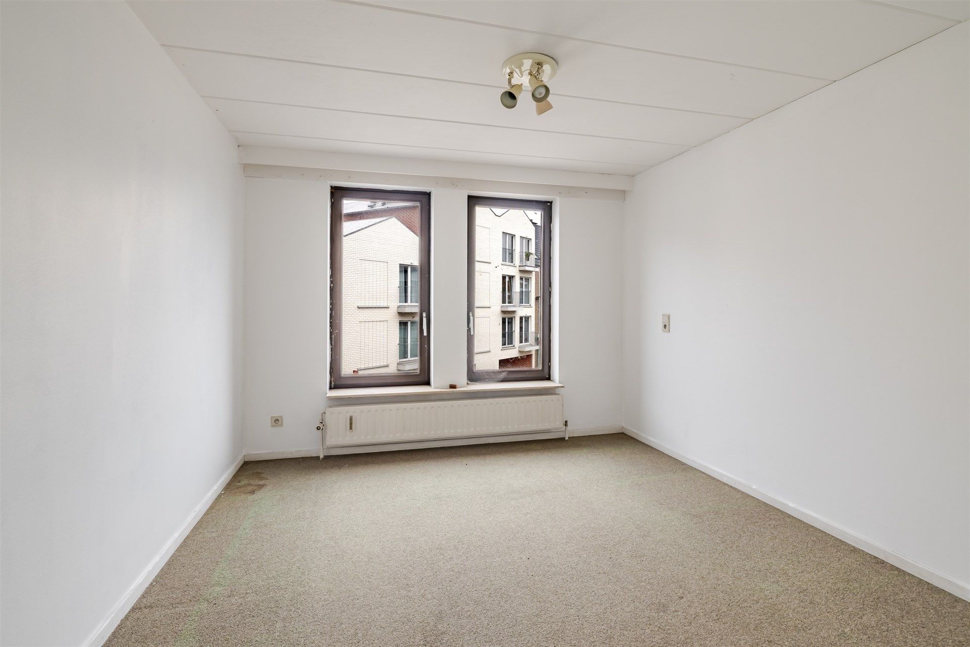 Opbrengsteigendom bestaande uit 7 appartementen + 1 kantoorruimte + 13 overdekte autostaanplaatsen foto 14