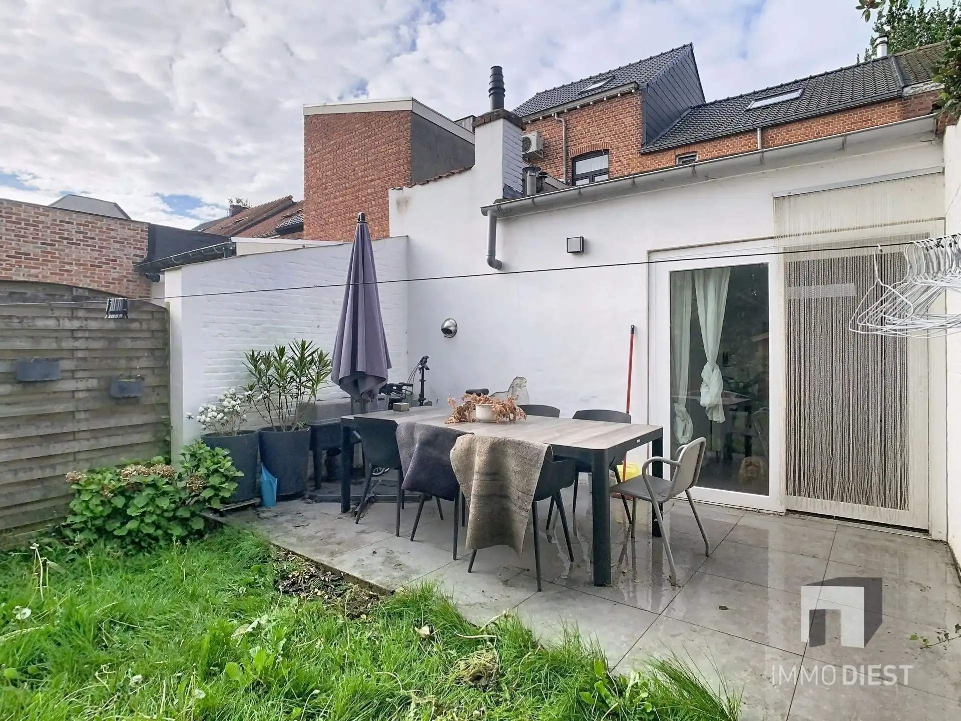 Knappe rijwoning met tuin en terras foto 30