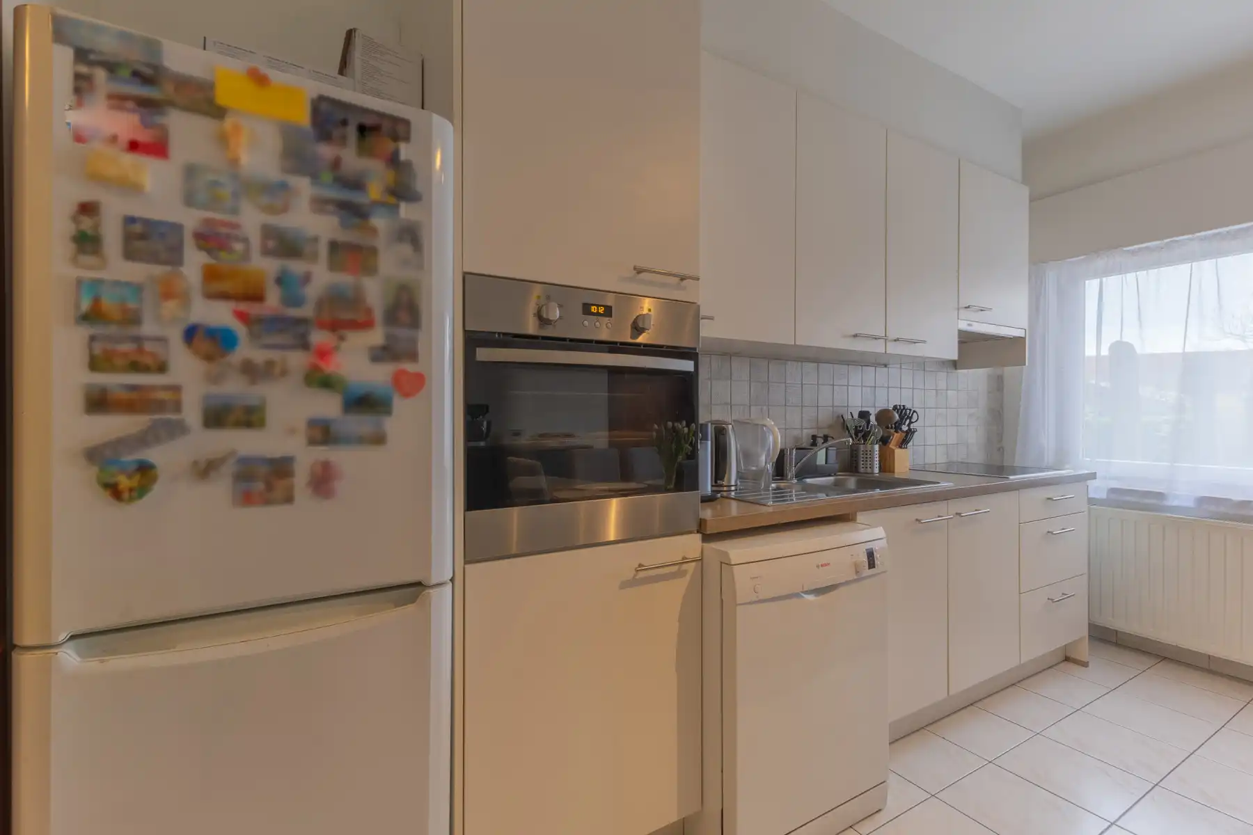 Gelijkvloers appartement met terras en tuin (+ kelder) foto 9