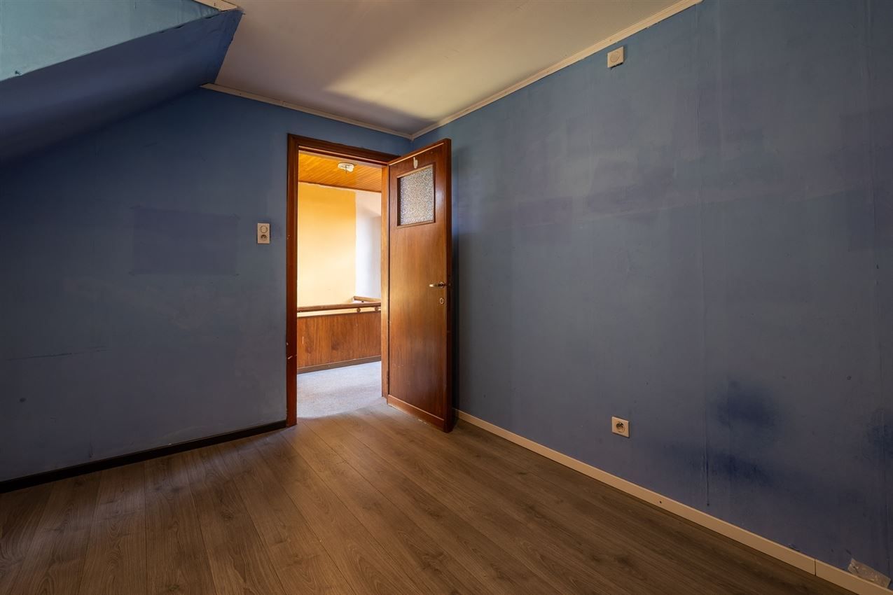 Ruime woning met zuidgerichte tuin en garage in rustige straat nabij centrum. EPC C en 5+ slaapkamers. foto 26